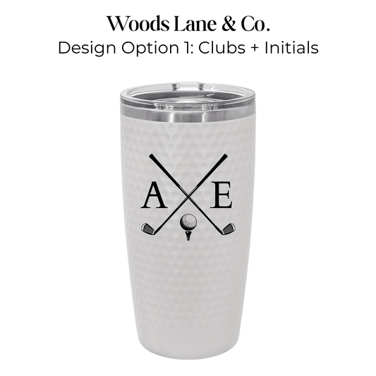 A white textured insulated tumbler with a clear lid, featuring a black crossed golf clubs and golf ball graphic with the initials 'A' and 'E'. Text above reads 'Woods Lane & Co.
